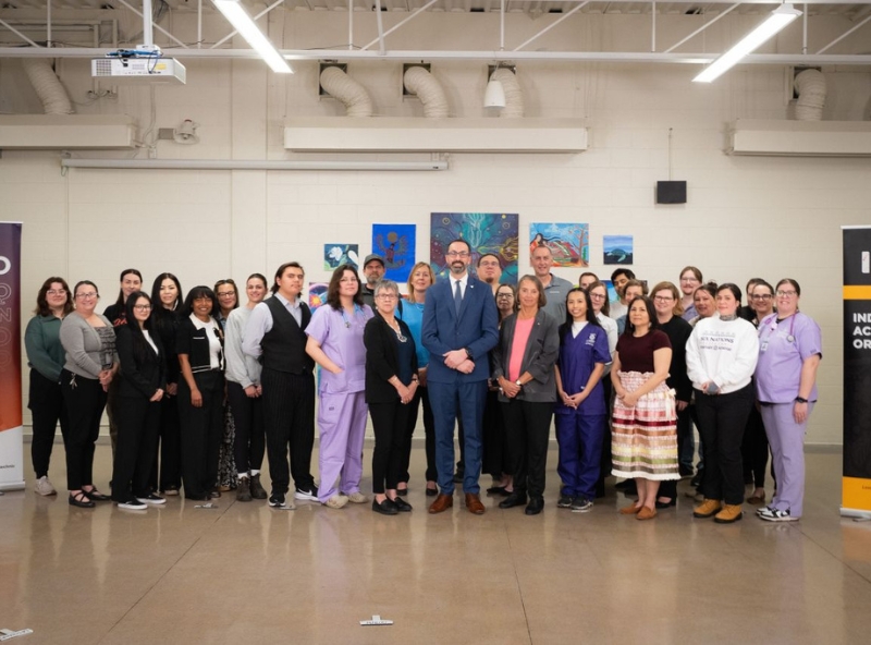 minister with snp students and staff