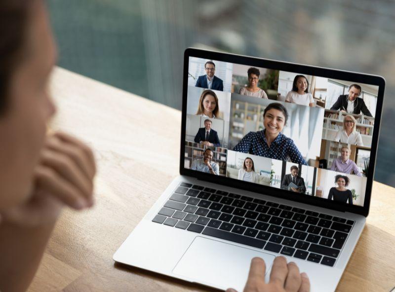 a laptop with a video call on the screen
