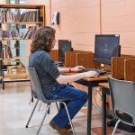 Student researching in library