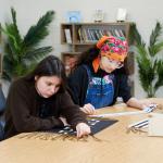 STEAM students examine wampum belts