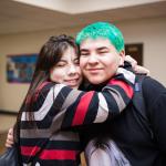 Students hugging.