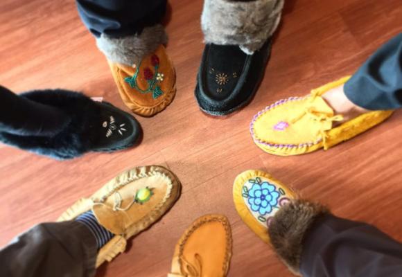 people wearing moccasins in a circle