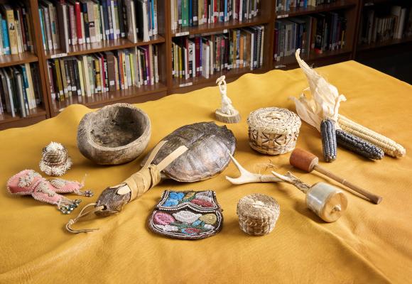 multiple indigenous cultural items on table