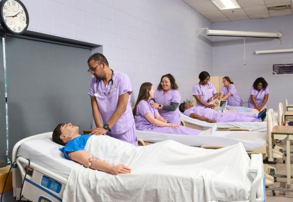 nurses in class working at beds