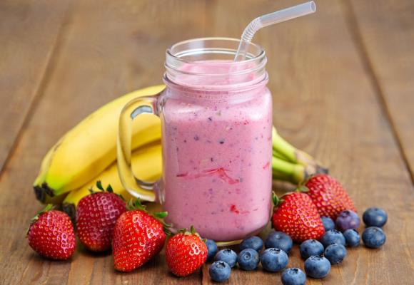 smoothie surrounded by fruit
