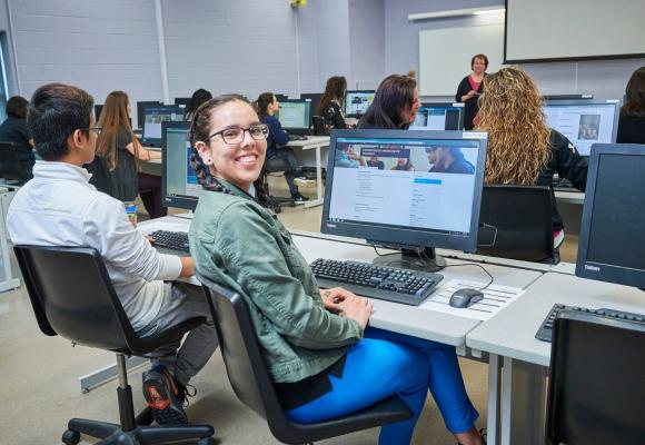 student in class on computer