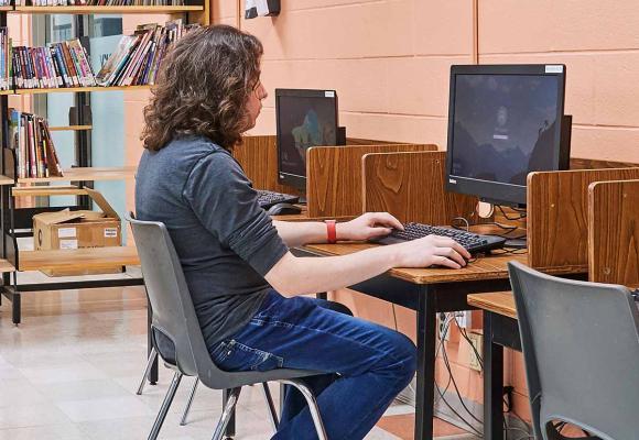 Student researching in library