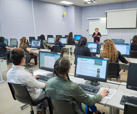 students at computers in a classroom