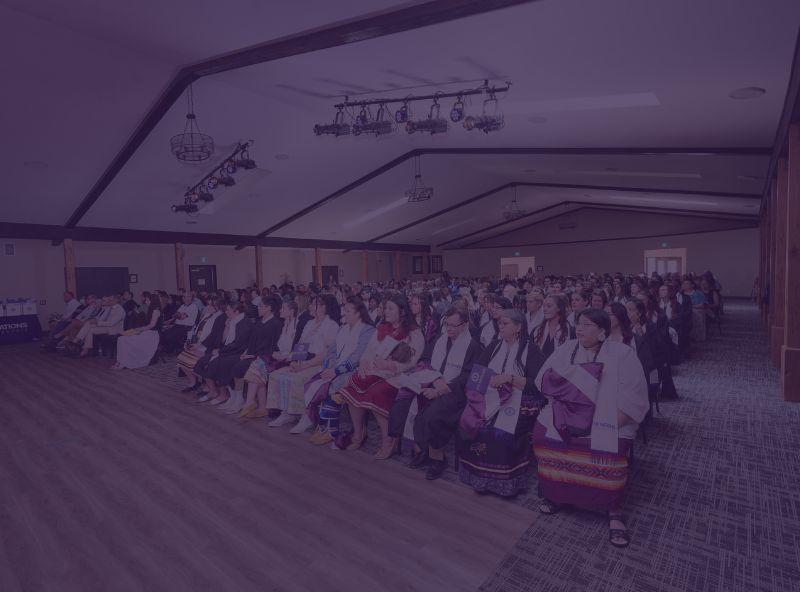 students seated in a hall