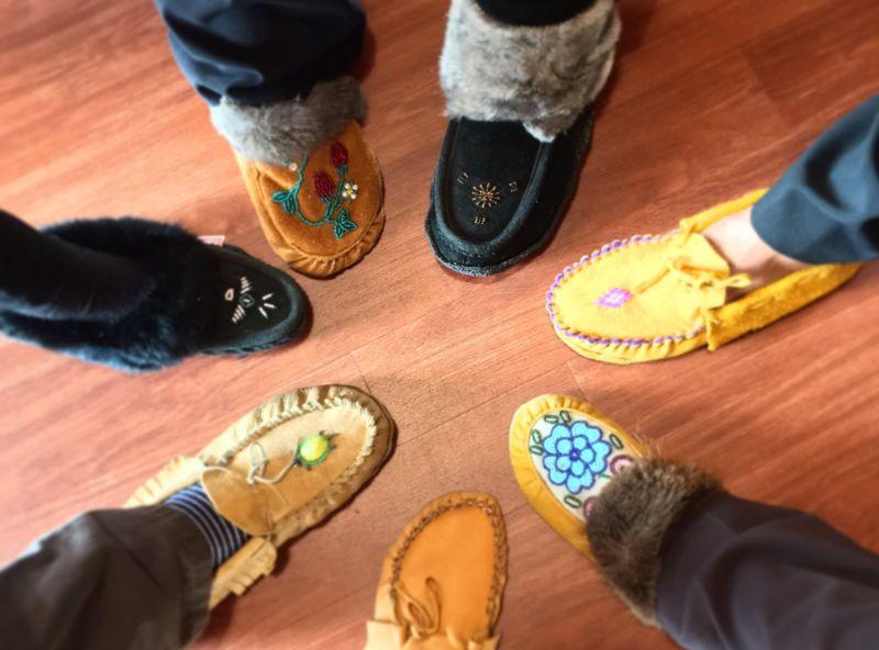 people wearing moccasins in a circle