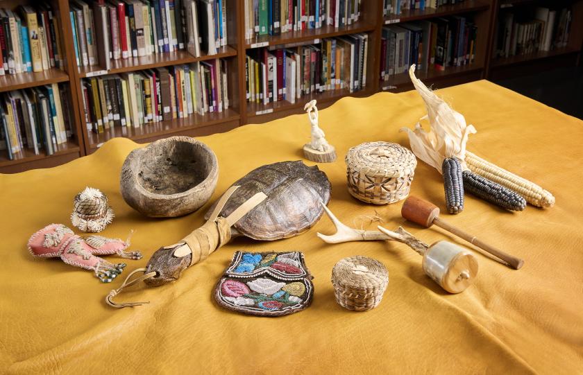 multiple indigenous cultural items on table