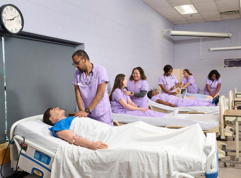 nurses in class working at beds