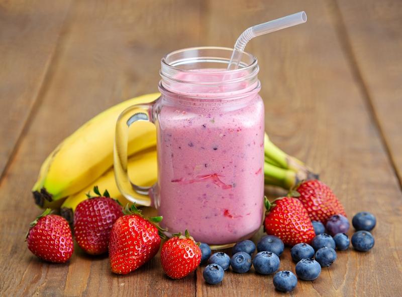 smoothie surrounded by fruit